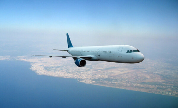 Airplane flying above earth backgroun