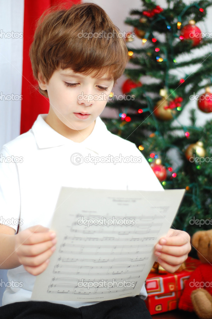 Boy singing a Christmas carol