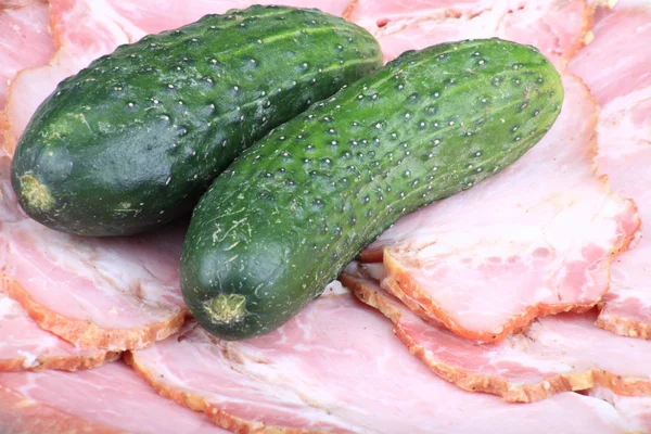 Two cucumber on ham meat — Stock Photo, Image