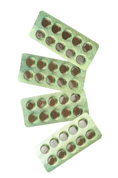 Veel tabletten onder blister geïsoleerd — Stockfoto