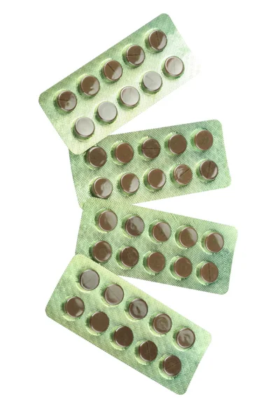 Veel tabletten onder blister geïsoleerd — Stockfoto