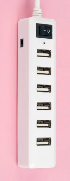 Hub USB na różowym tle — Zdjęcie stockowe