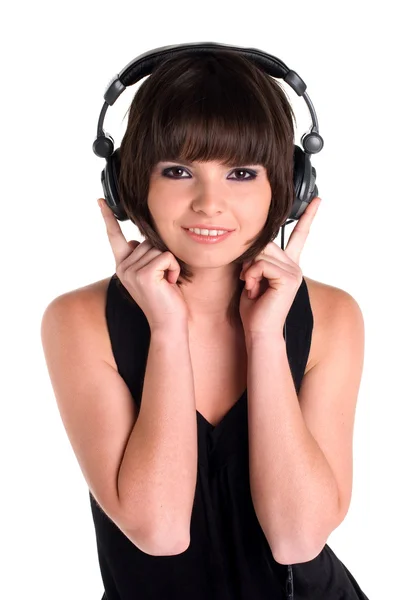 Mujer tractiva con auriculares sobre fondo blanco — Foto de Stock