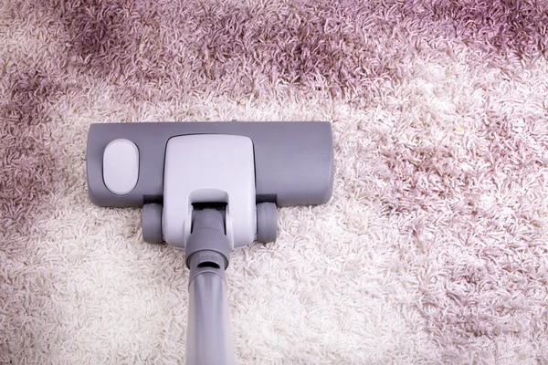 Vacuuming very dirty white carpet — Stock Photo, Image