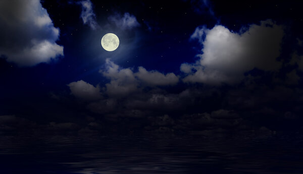 Sea under night sky with moon