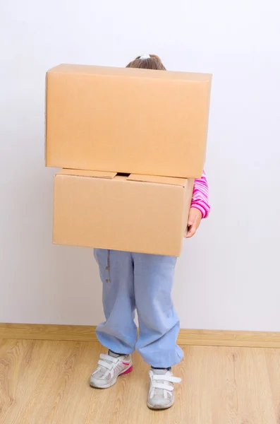 Menina com caixas — Fotografia de Stock