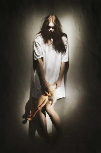 Zombie girl holding doll — Stock Photo, Image