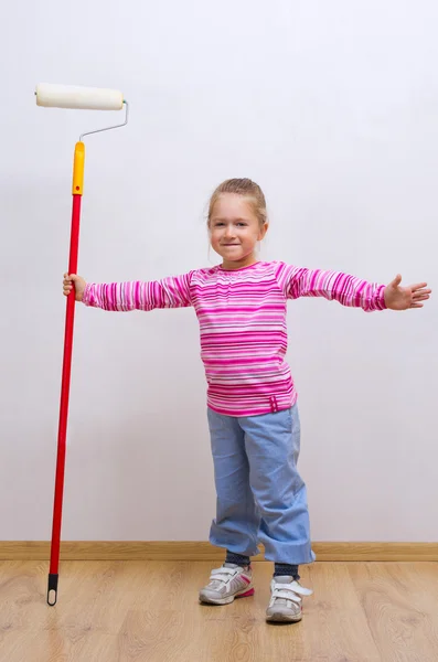 Little girl with painting roller — Stock Photo, Image