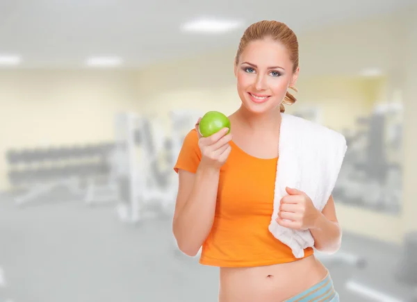 Deportiva mujer con manzana —  Fotos de Stock