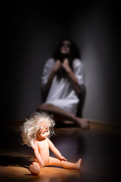 Crazy girl and plastic doll — Stock Photo, Image