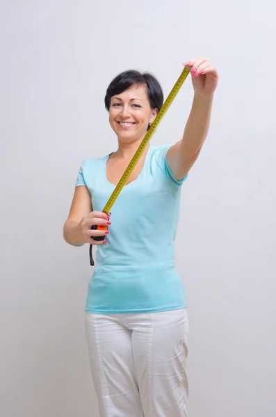 Woman with measurement tape — Stock Photo, Image