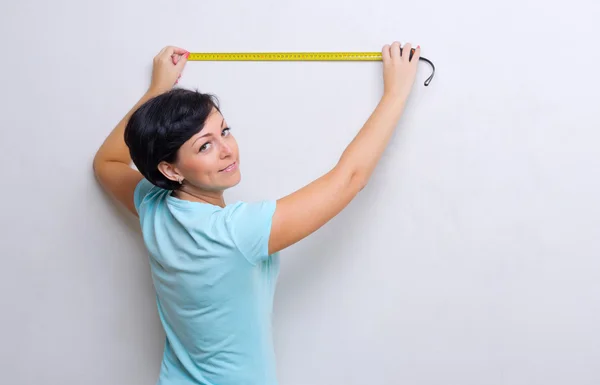 Woman with measurement tape — Stock Photo, Image