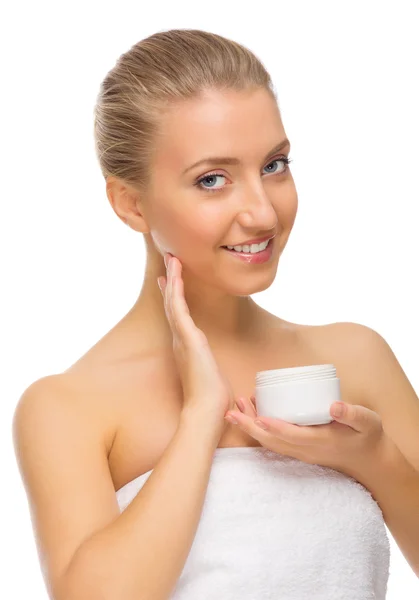 Young smiling girl with body cream Royalty Free Stock Images