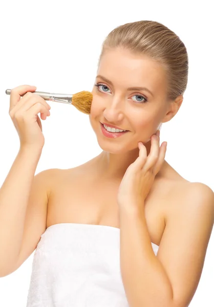 Young smiling girl with makeup brush — Stock Photo, Image