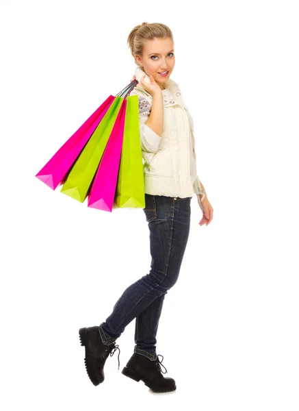 Chica joven con bolsas aisladas — Foto de Stock