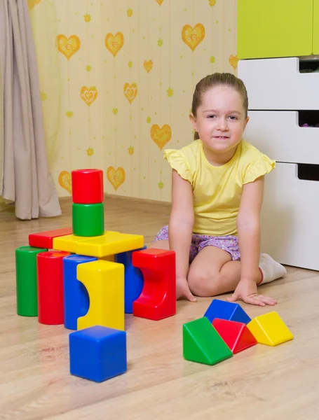 Little girl with plastic cubes — Stock Photo, Image