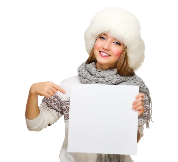 Young smiling girl showing empty banner — Stock Photo, Image