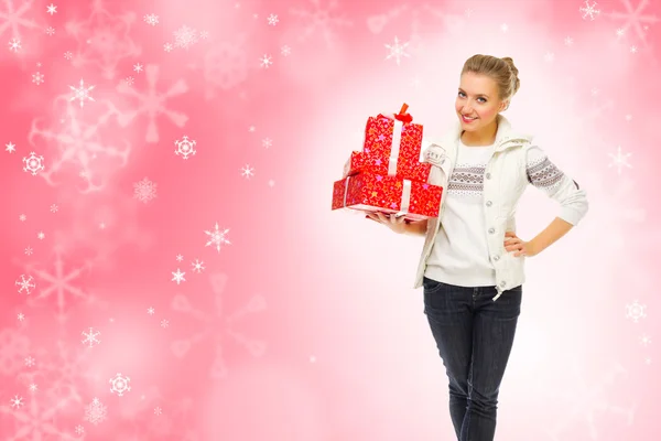 Young smiling girl with gift boxes — Stock Photo, Image