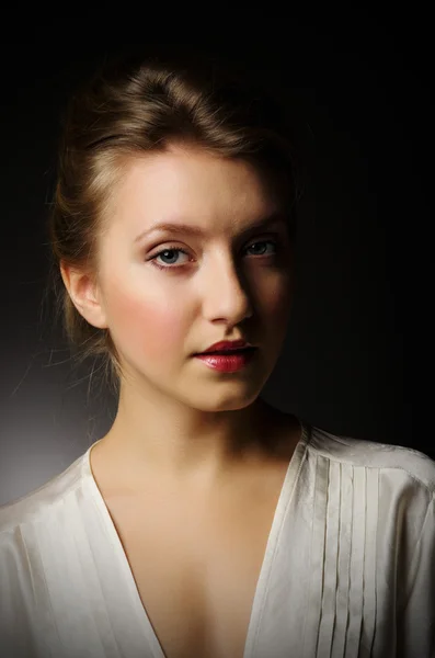 Beauty portrait of young girl on grey background — Stock Photo, Image