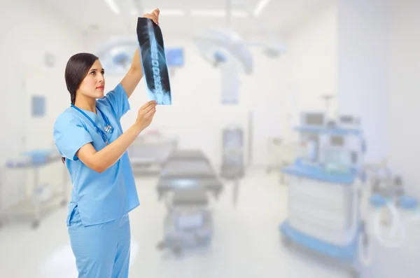 Young doctor with x-ray on medical office — Stock Photo, Image