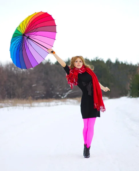 Mujer joven con paraguas multicolor — Foto de Stock