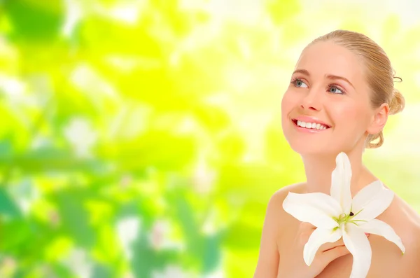 Young healthy woman on spring background — Stock Photo, Image