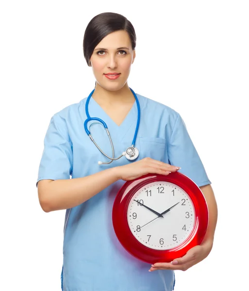 Unga läkare med klocka — Stockfoto