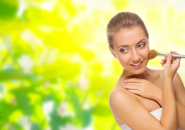 Young healthy girl with makeup brush — Stock Photo, Image