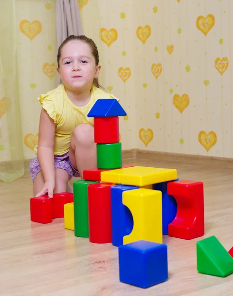 Little girl playing with cubes — Stock Photo, Image