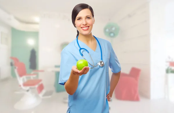 Doctor with green apple — Stock Photo, Image