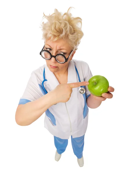 Lustige ältere Arzt mit Apfel — Stockfoto