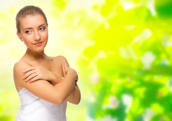 Young healthy girl on floral background — Stock Photo, Image