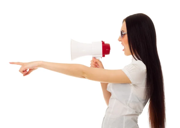 Girl with megaphone shows pointing gesture — Stock Photo, Image
