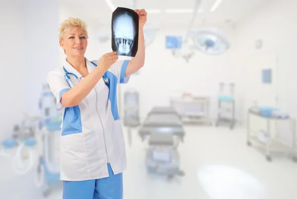 Mature doctor with x-ray — Stock Photo, Image