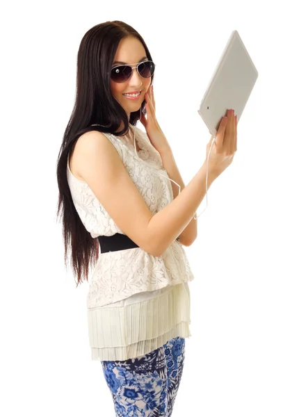 Young girl talks by tablet PC — Stock Photo, Image