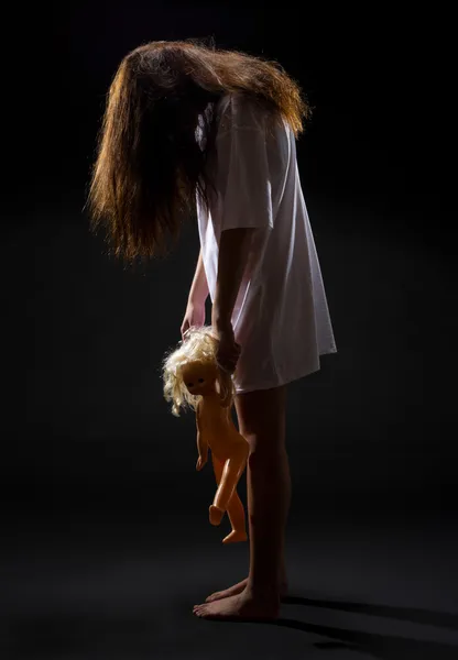 Zombie girl with doll — Stock Photo, Image