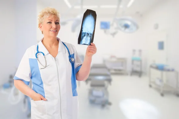 Mature doctor with x-ray — Stock Photo, Image