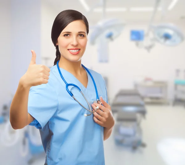 Young doctor shows ok gesture — Stock Photo, Image