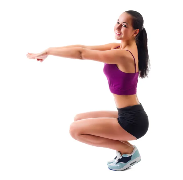 Jovem mulher esportiva fazendo exercícios de ginástica — Fotografia de Stock