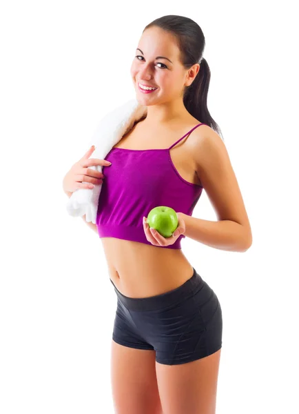 Joven chica deportiva con manzana — Foto de Stock