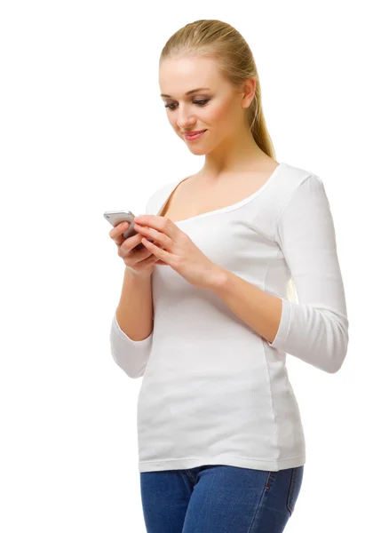 Young girl writing message on mobile phone — Stock Photo, Image