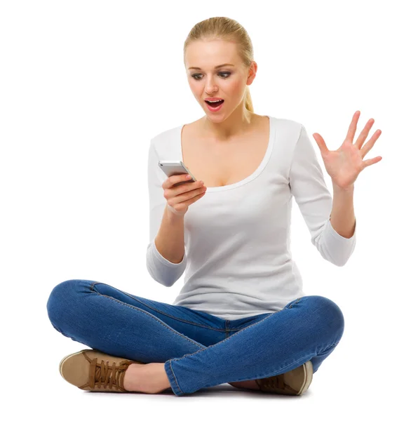 Smiling young girl with mobile phone — Stock Photo, Image