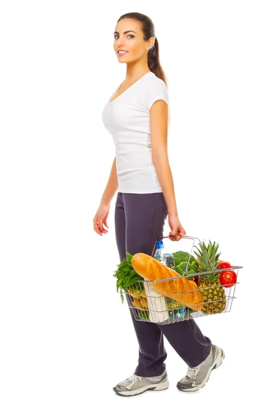 Young girl with shopping basket — Stock Photo, Image