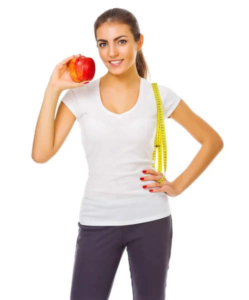 Young girl with apple and measurement tape — Stock Photo, Image