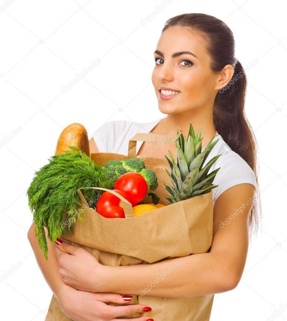 Girl with a bag full of products — Stock Photo © rbvrbv 39456041