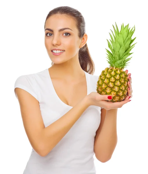 Jong meisje met ananas — Stockfoto