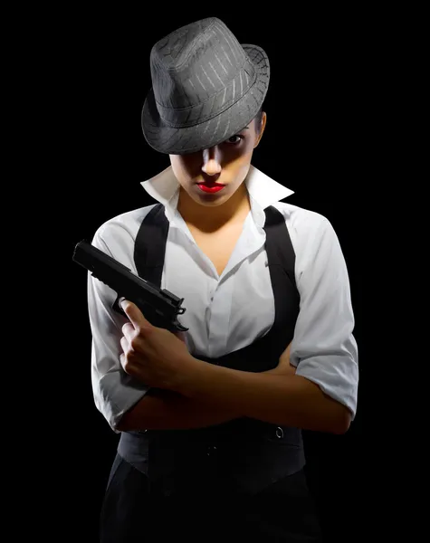 Девушка с пистолетом и шляпой — стоковое фото