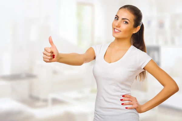 Young healthy woman shows ok gesture — Stock Photo, Image