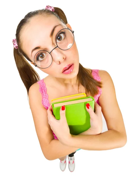 Colegiala divertida con gafas nerd y libros — Foto de Stock