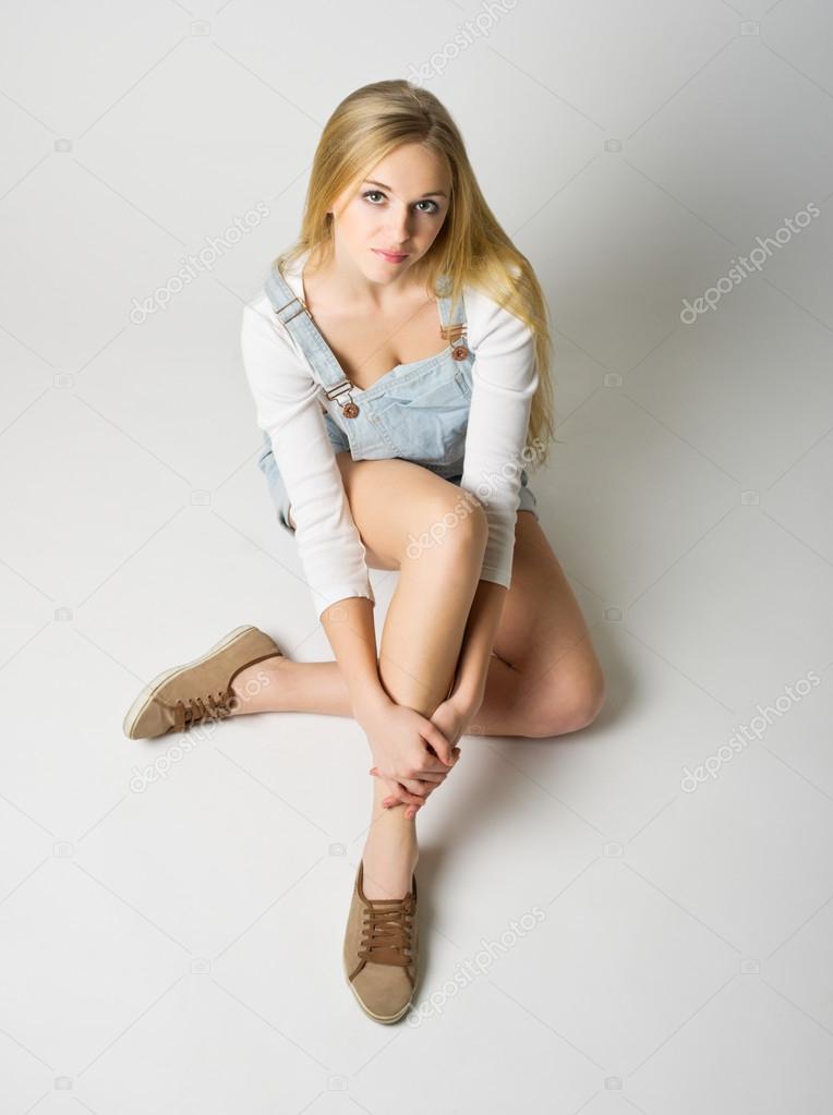 Young woman on grey